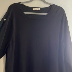 Women’s black sweater.